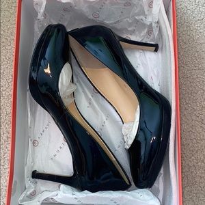 Navy blue patent leather pumps